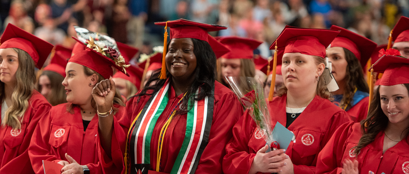 Students smiling at graduation